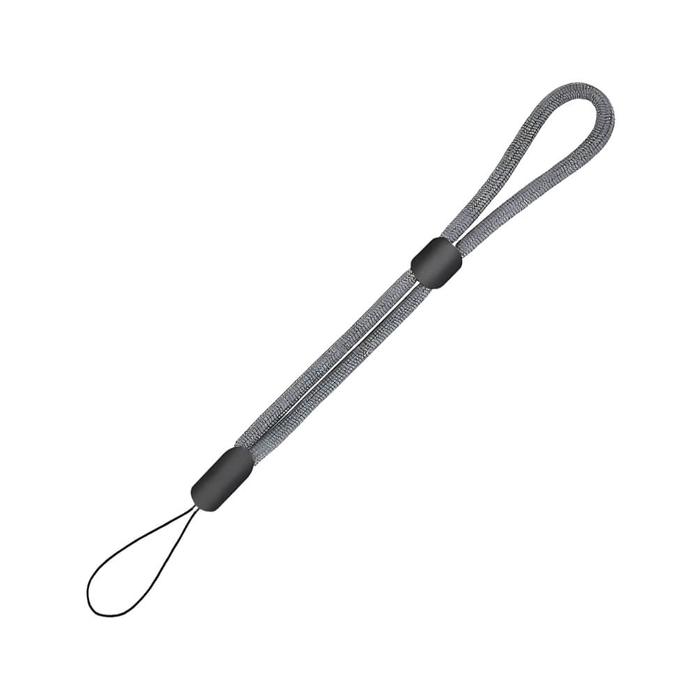 Product photograph of a grey braided fabric wrist strap featuring two black plastic adjusters and a small black attachment loop