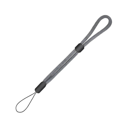 Product photograph of a grey braided fabric wrist strap featuring two black plastic adjusters and a small black attachment loop