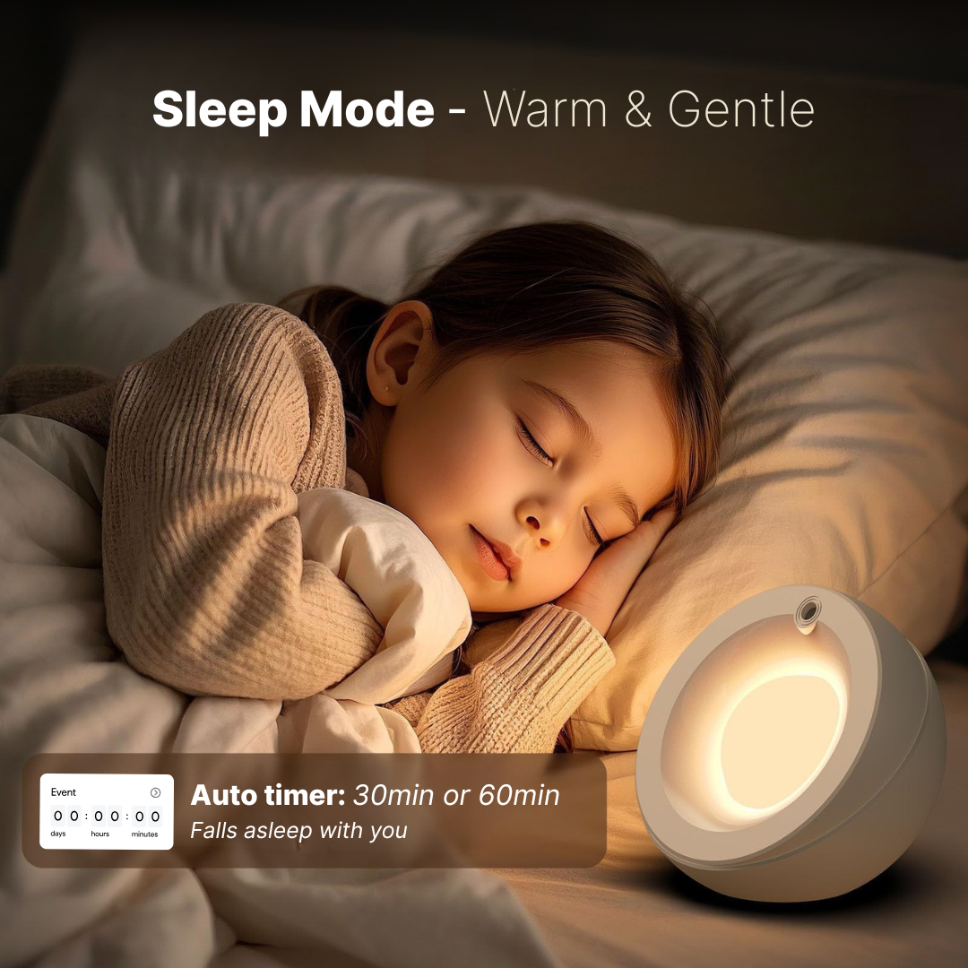 A young child peacefully sleeping in bed with a warm glowing spherical night light on the bedside table, wearing a beige knitted sweater, featuring overlaid text Sleep Mode - Warm & Gentle and Auto timer